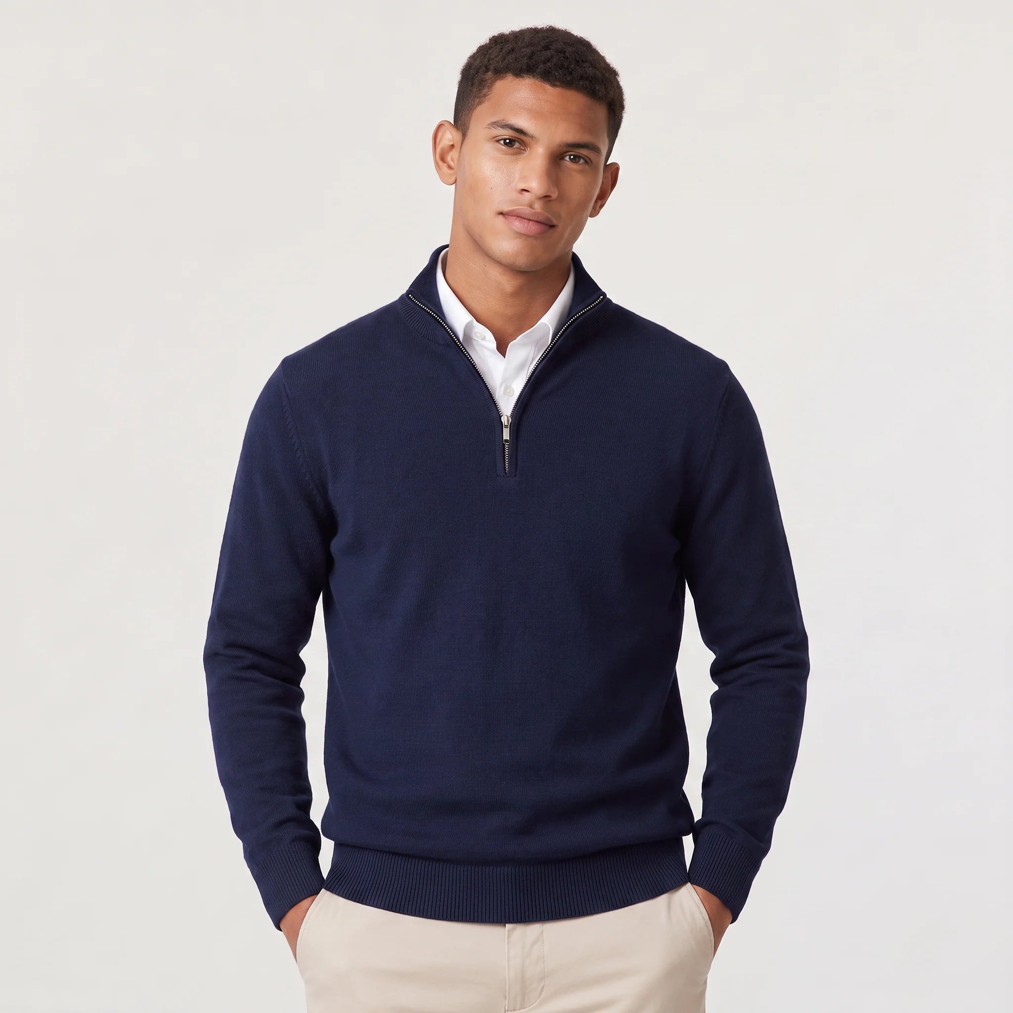 Men's quarter-zip knit jumper in navy with stand collar and ribbed cuffs worn over white shirt
