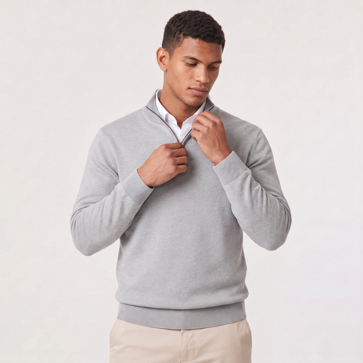 Men's dark grey quarter-zip knit jumper styled with chinos for business-casual wear