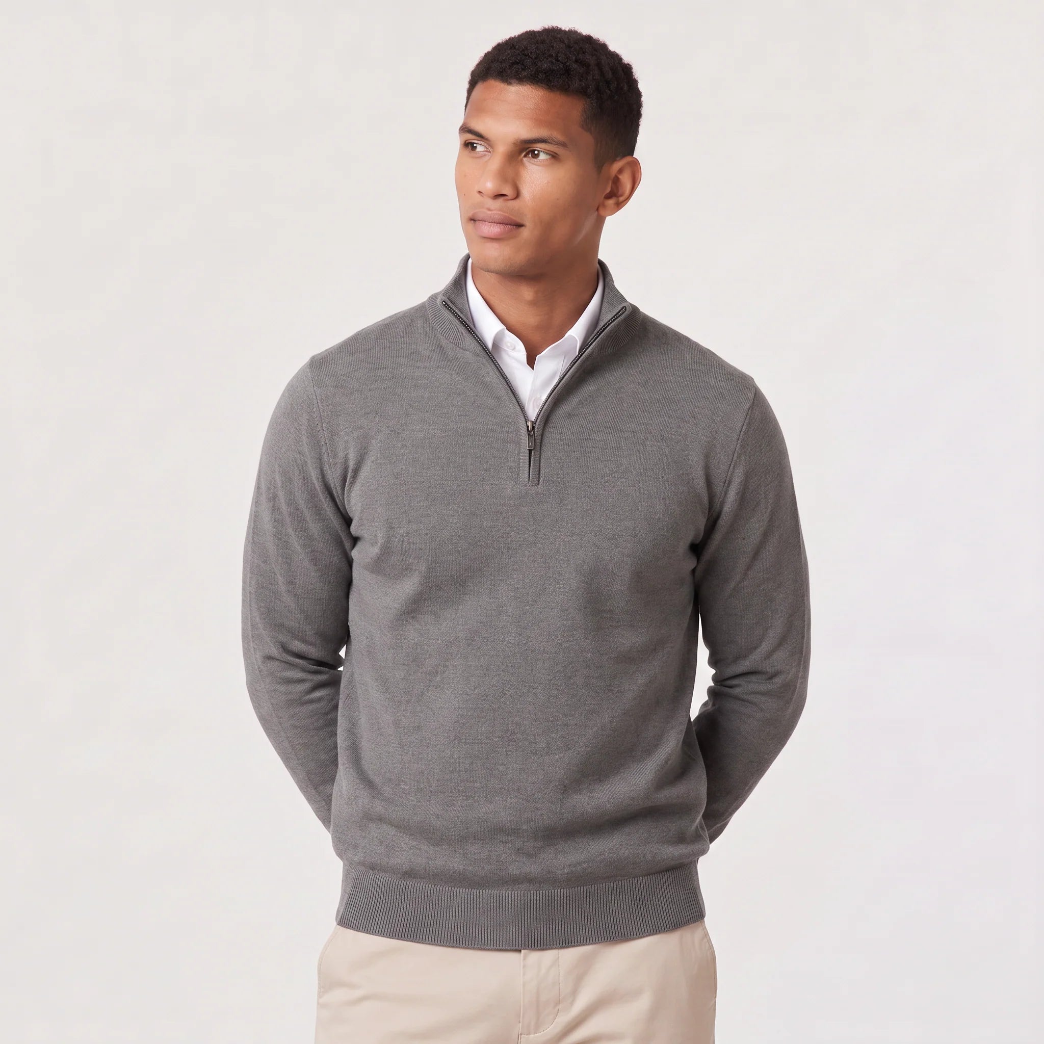 Men's light grey quarter-zip knit jumper displaying smooth knit fabric and stand collar