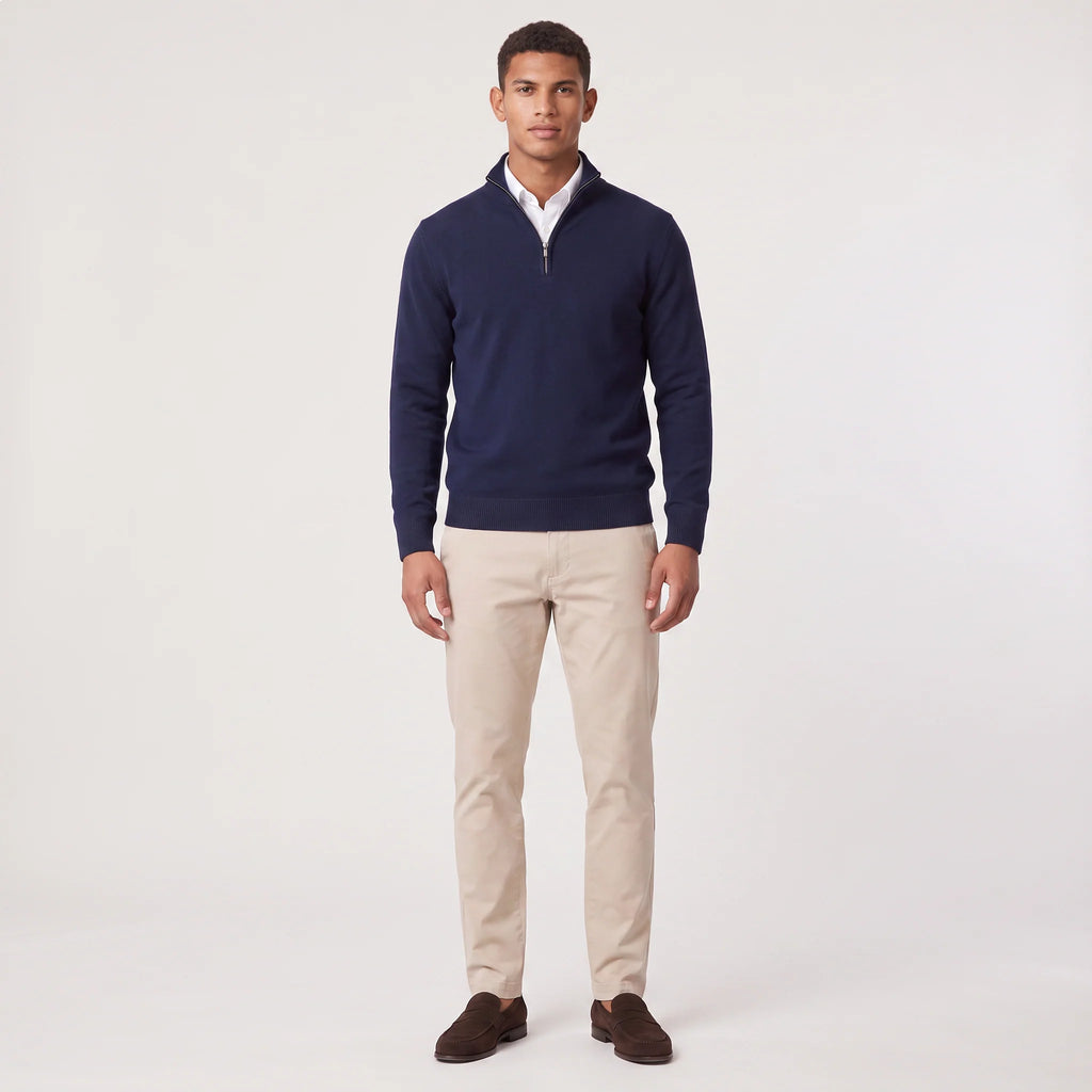 Detail of quarter-zip closure on men's knit jumper with contrast trim at neckline