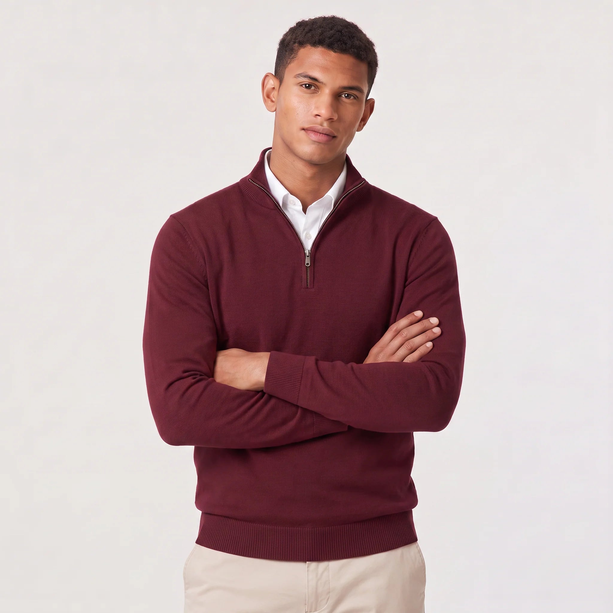 Men's quarter-zip knit jumper in pink layered over white shirt for smart-casual styling