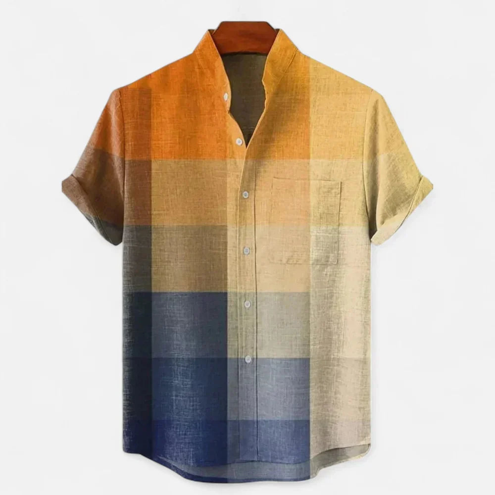 Men's colour block short sleeve shirt with orange, beige, and navy panels on flat lay