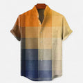 Men's colour block short sleeve shirt with orange, beige, and navy panels on flat lay