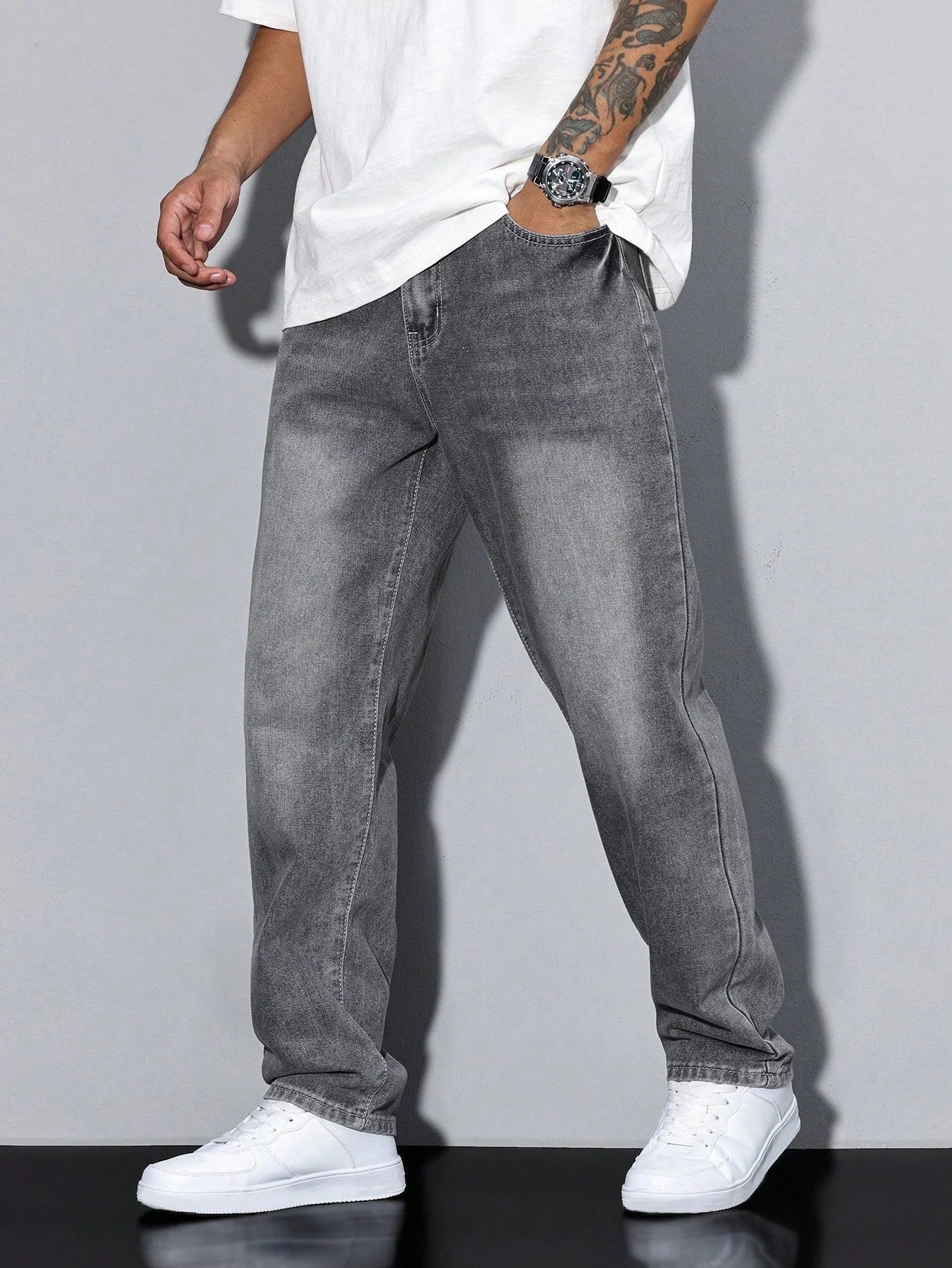 Side view of men's straight leg jeans showing relaxed fit through hip and thigh