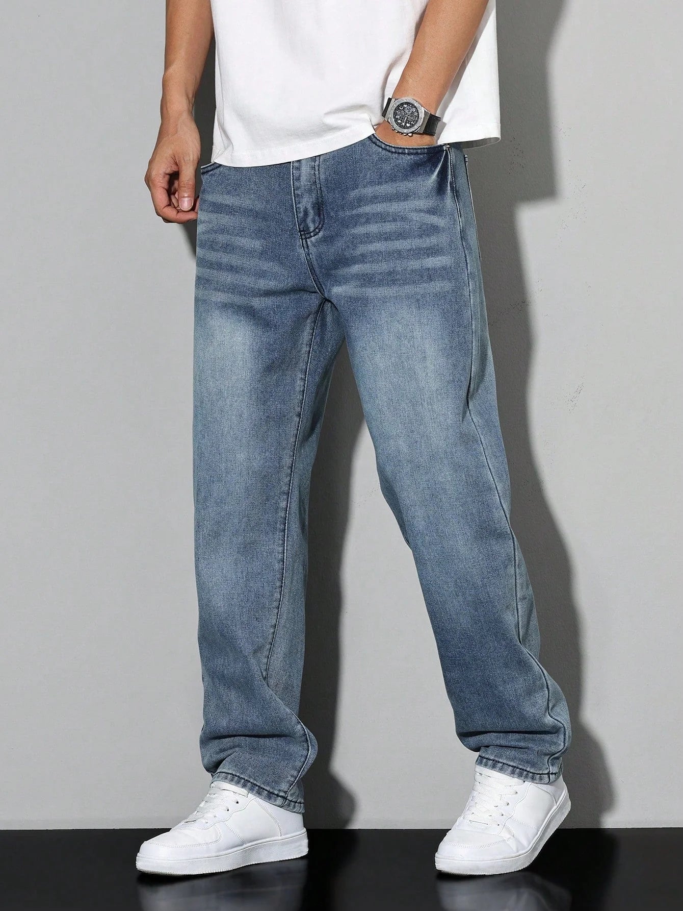 Detail of washed grey denim fabric showing structured texture and finish