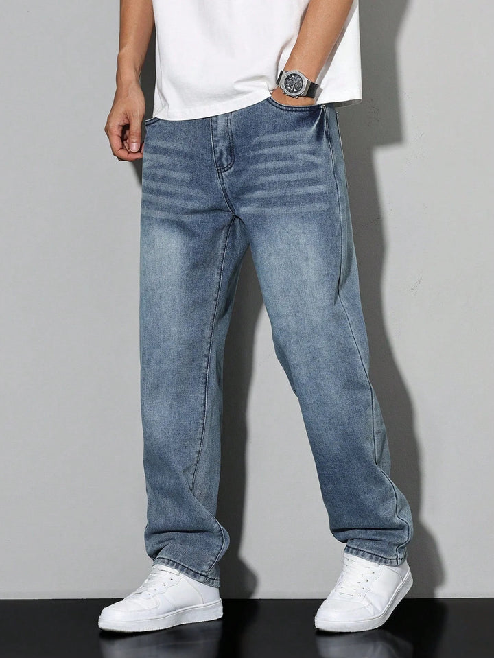 Detail of washed grey denim fabric showing structured texture and finish