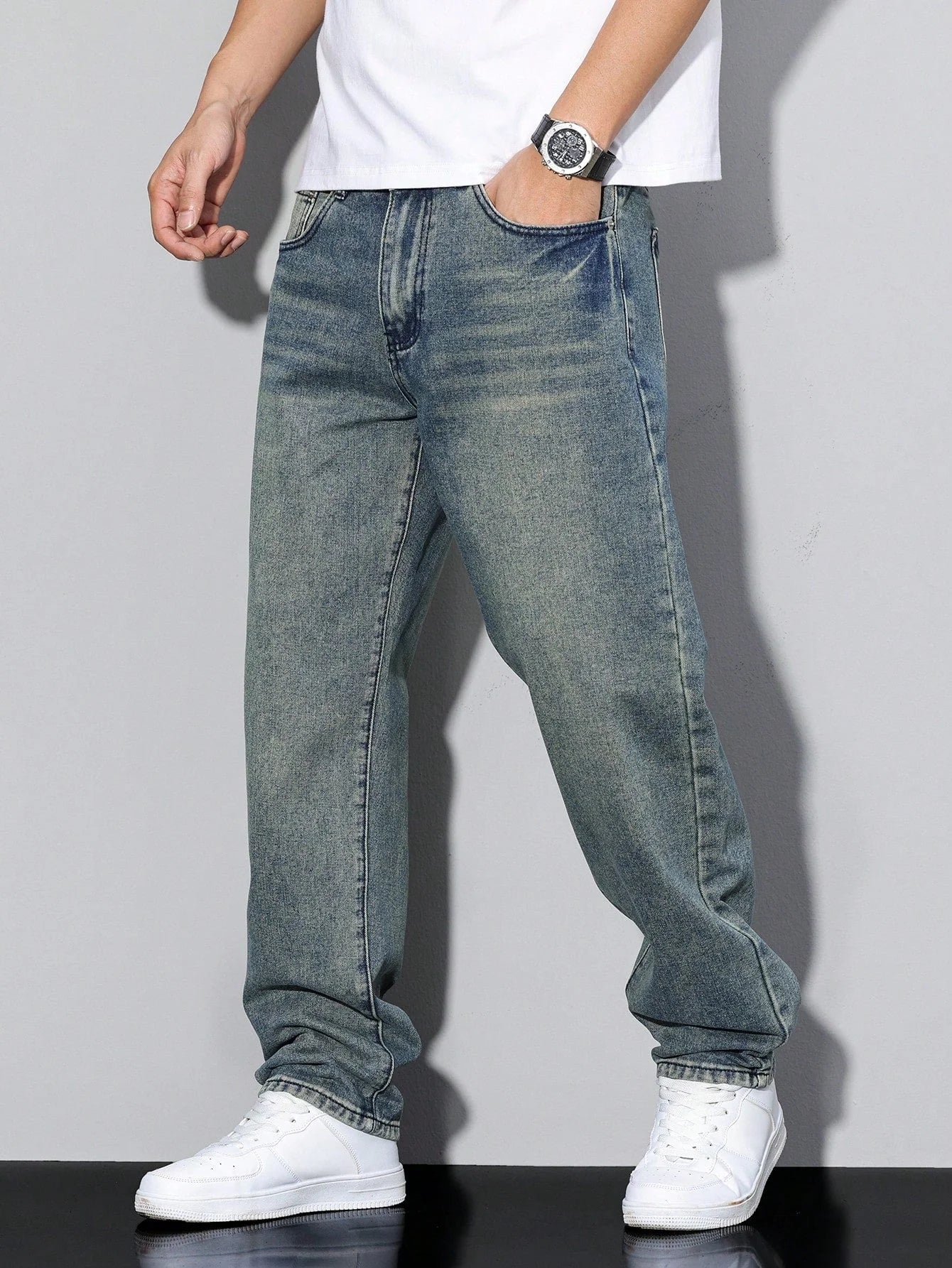 Close-up of five-pocket construction on men's straight leg jeans