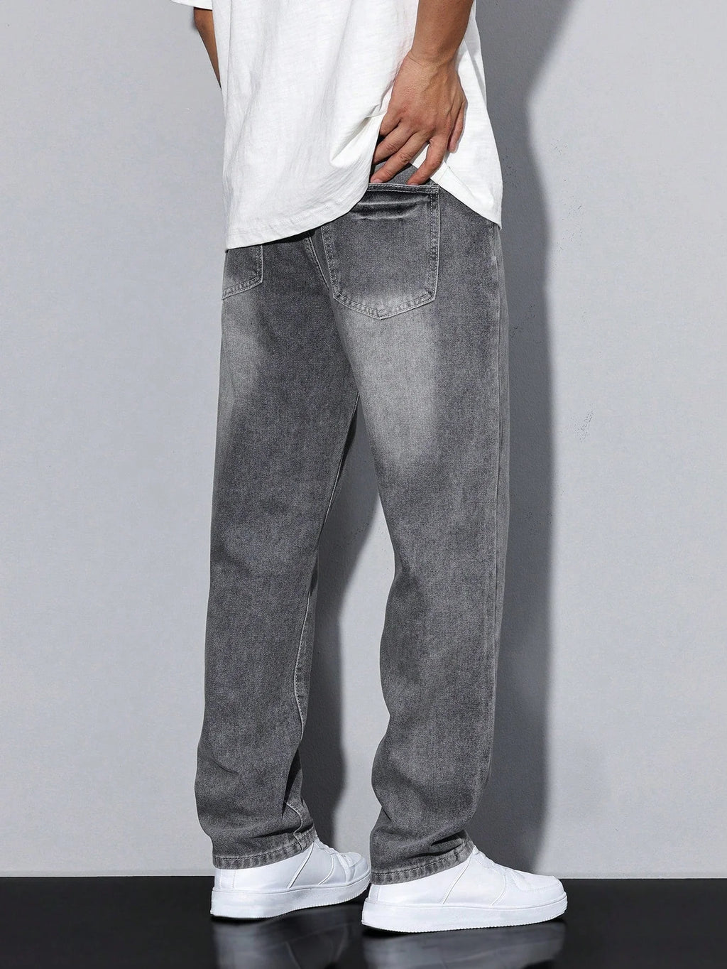 Men's relaxed fit jeans styled with white t-shirt for everyday wear