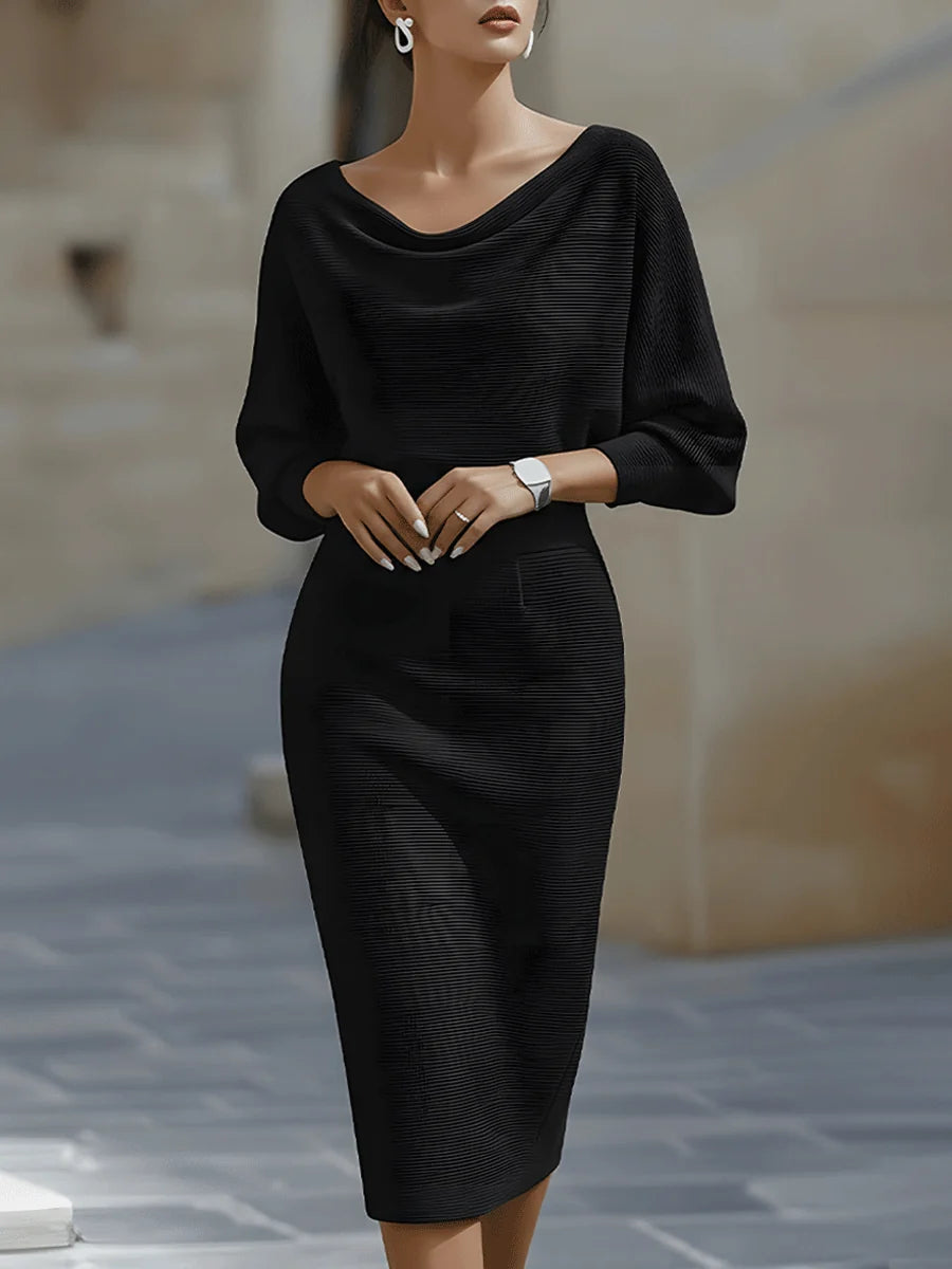 Close-up view of draped cowl neckline on navy ribbed midi dress with three-quarter sleeves