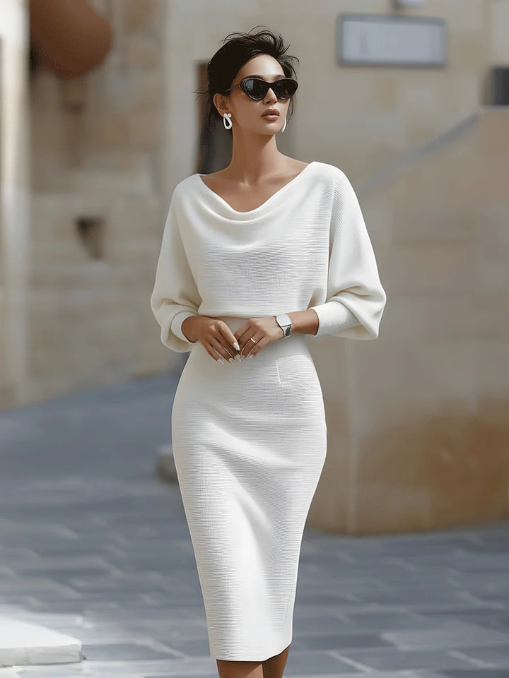 Three-quarter sleeve detail on cowl neck midi dress showing batwing cut and ribbed fabric