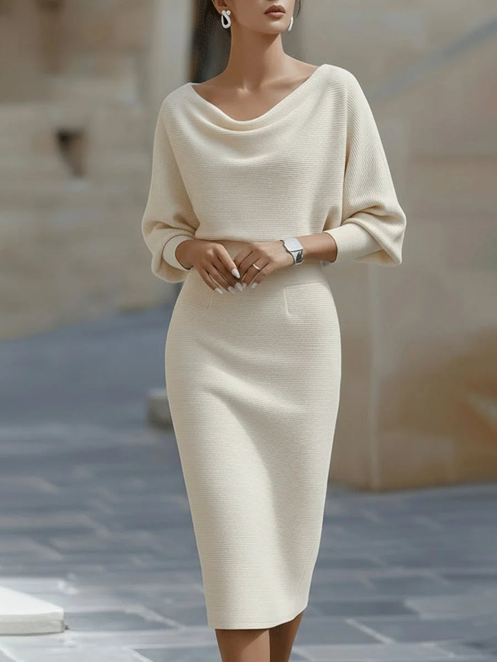 Front view of draped cowl neckline midi dress with fitted skirt and structured silhouette
