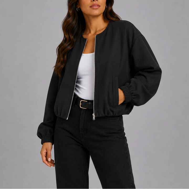 Women's bomber jacket in grey fleece fabric showing relaxed fit and cropped length detail