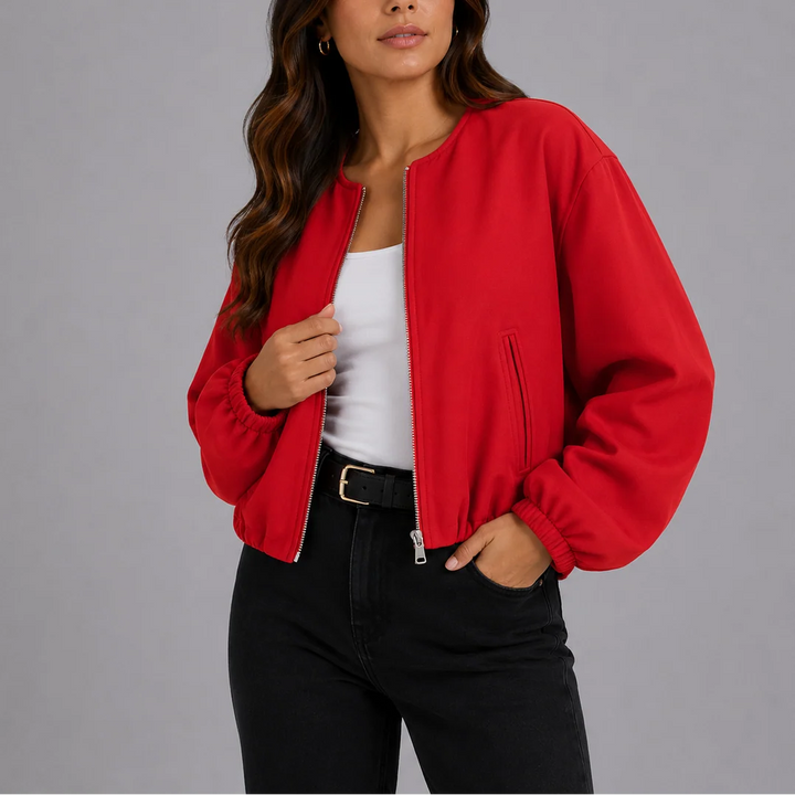 Rear view of women's bomber jacket showing relaxed silhouette and elasticated waist hem finish