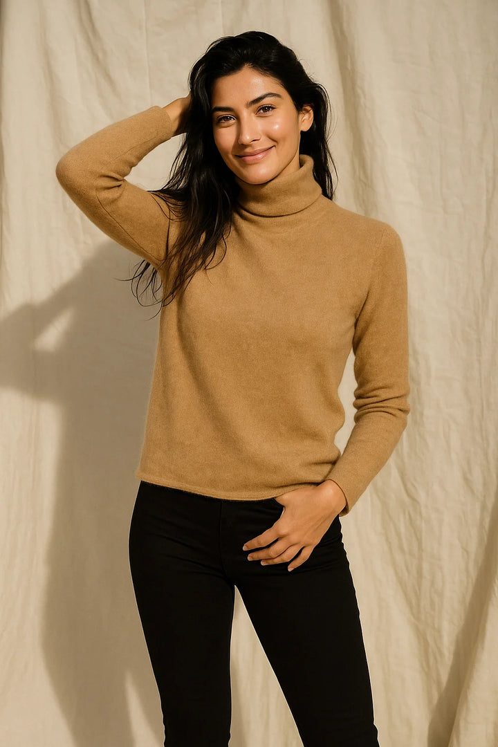 Back angle of a women's cashmere turtleneck displaying the smooth fabric and structured ribbed trims