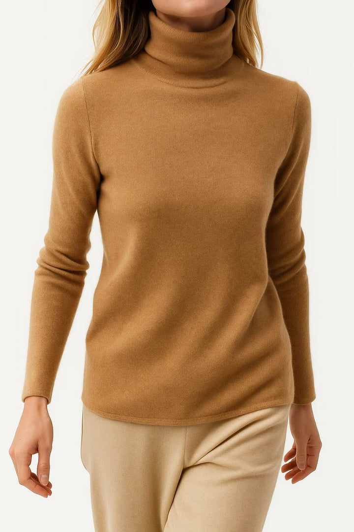 Detail shot of ribbed cuffs and sleeve construction on a women's cashmere turtleneck jumper