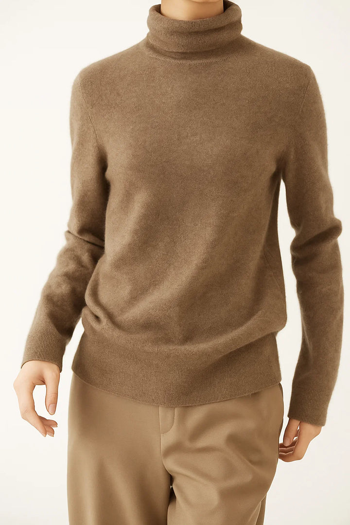 Side profile of a model wearing a cashmere turtleneck, showing the close-fitting neck and relaxed body
