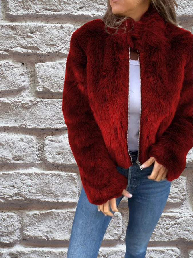 Side profile of women's brown faux fur bomber jacket showing relaxed fit and cropped length