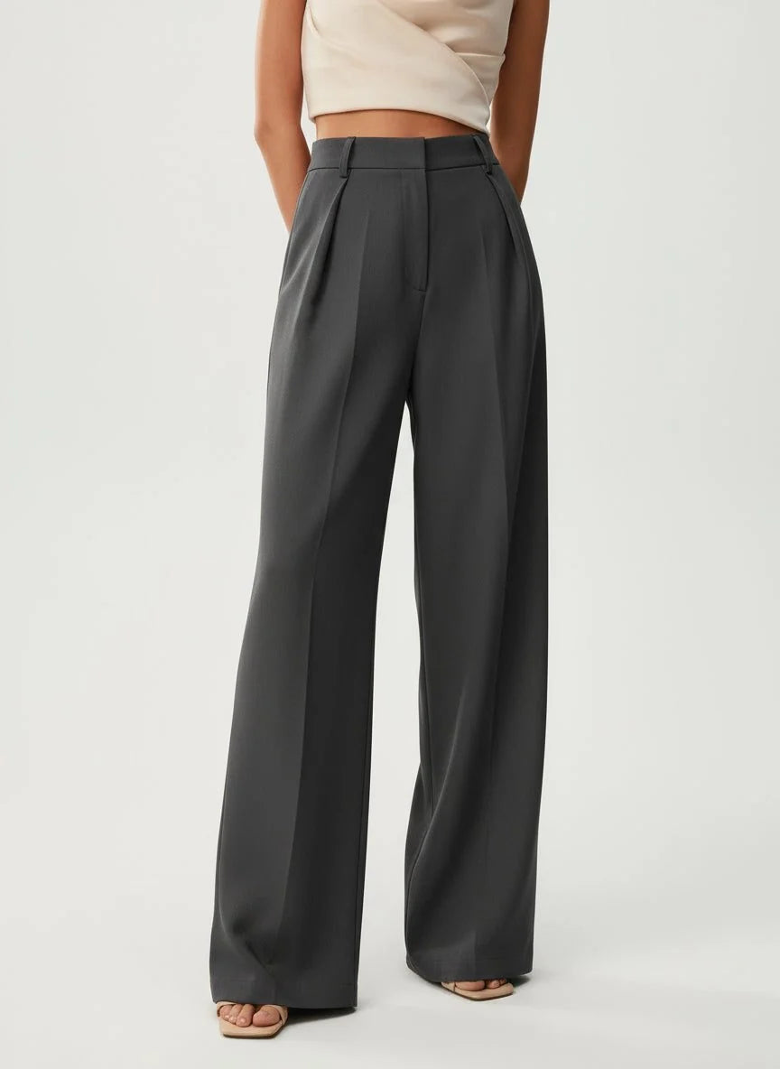 Women's tailored high waist trousers in camel with wide leg and relaxed fit shown from back