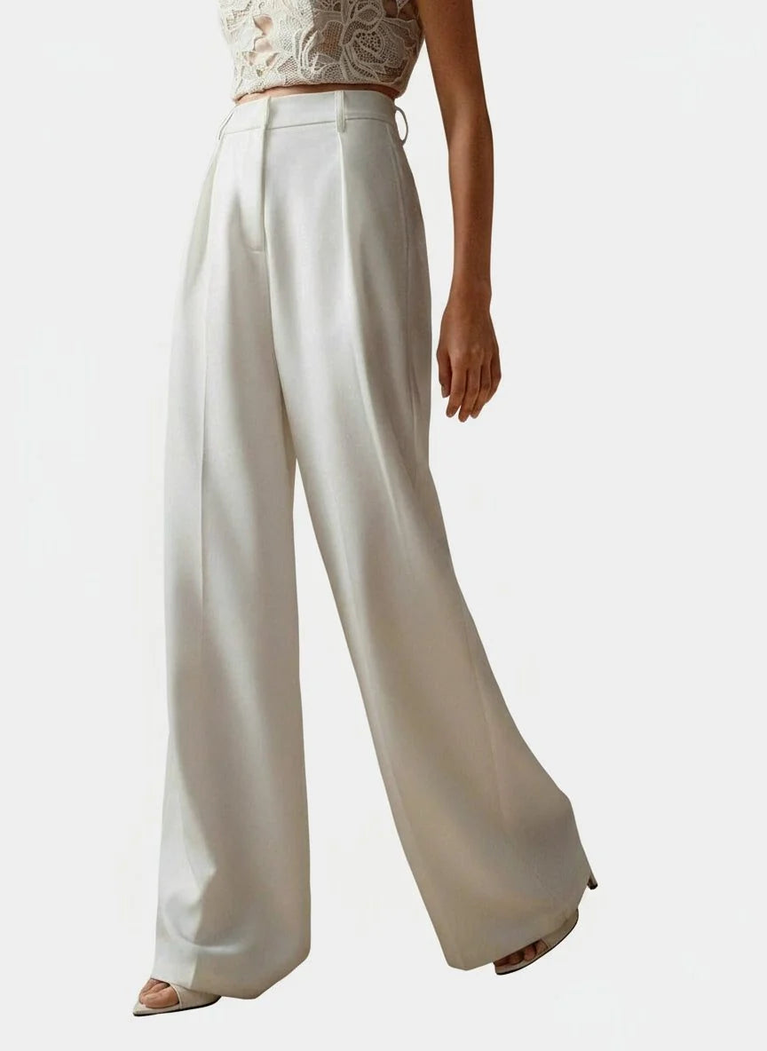 Camel women's high waist trousers with wide leg design and clean vertical lines for versatile styling