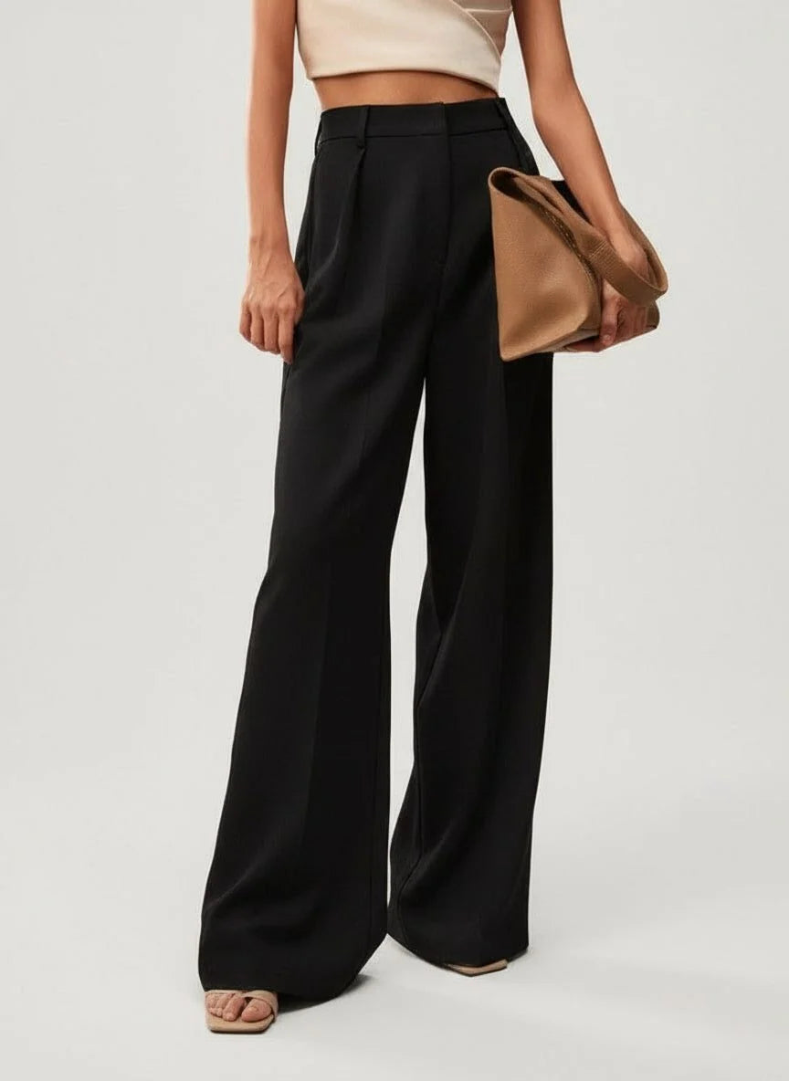 Women's wide leg trousers in camel showing high waist tailored finish and smooth fabric drape
