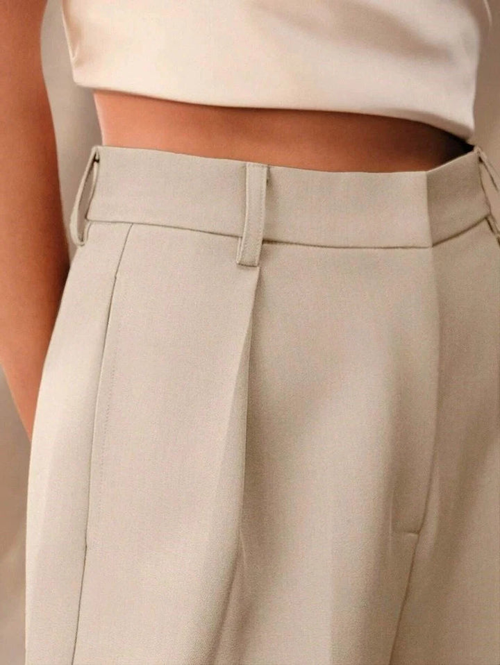 Camel tailored trousers for women featuring high waist and wide leg cut with smooth drape