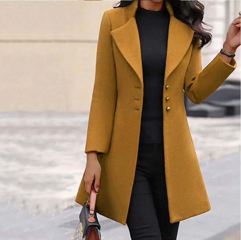 Detail shot of women's long tailored coat highlighting smooth fabric finish, long sleeves, and polished construction.