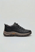 Men's cushioned walking shoes in black with chunky outsole and lace-up closure on neutral background