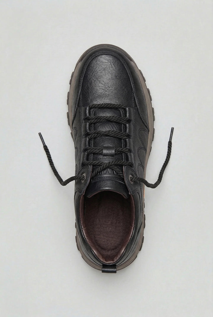 Close-up of men's cushioned walking shoes highlighting deep tread outsole and padded collar detail