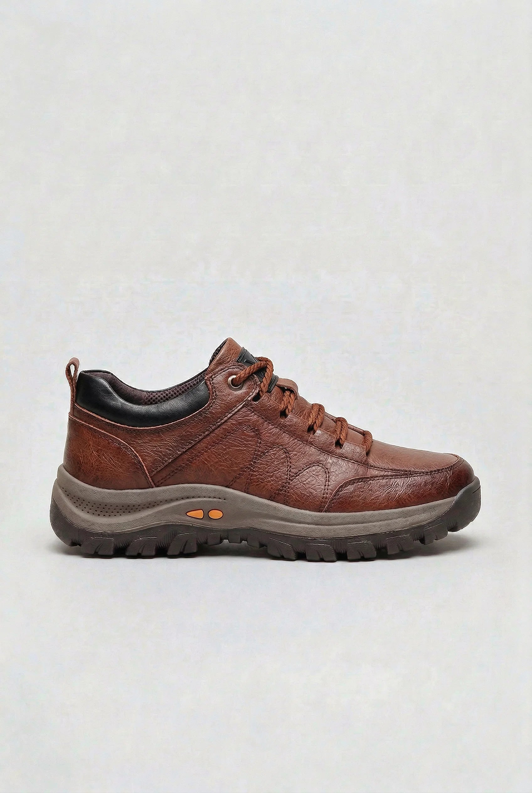 Men's cushioned walking shoes displayed from above showing lace-up design and tonal upper panelling