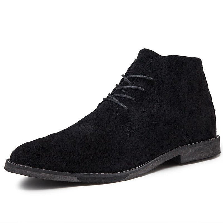 Close-up of suede-effect upper and contrasting flat sole on men's desert boots