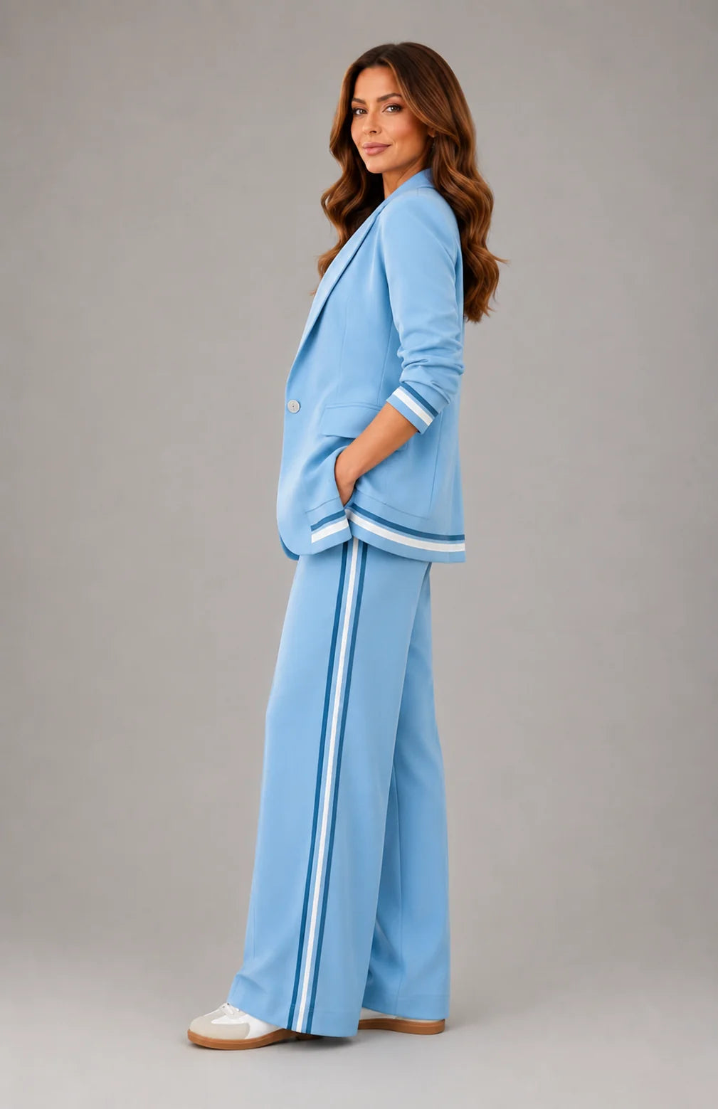 Close-up view of tailored blazer with single-button closure and notched lapels in light blue fabric