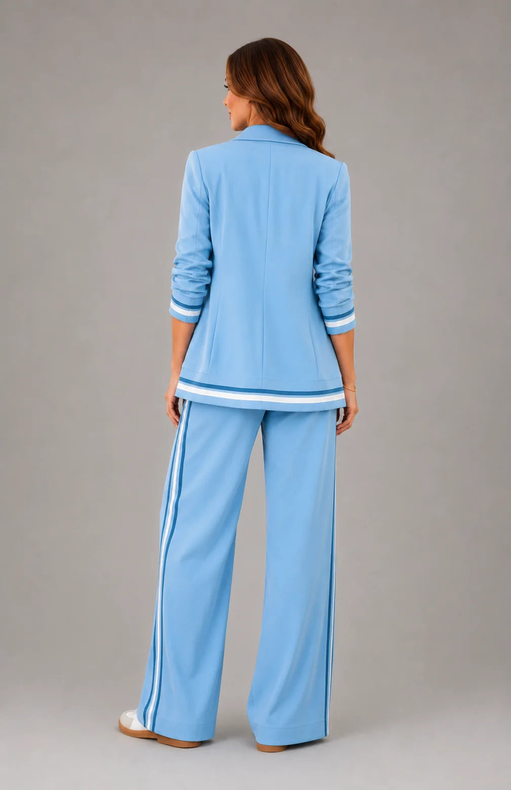 Side view of women's two-piece suit set showing relaxed blazer fit and wide leg silhouette