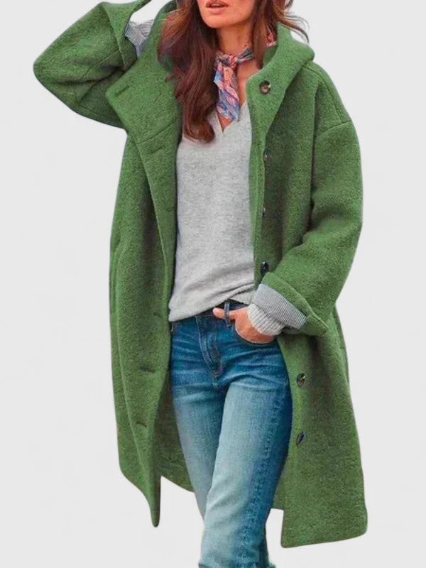 Women's hooded bouclé coat styled with jeans showing versatile layering options