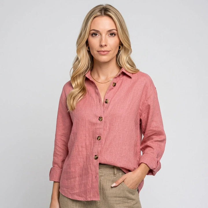 Detail shot of relaxed linen shirt collar and button placket showing structured design and lightweight fabric drape