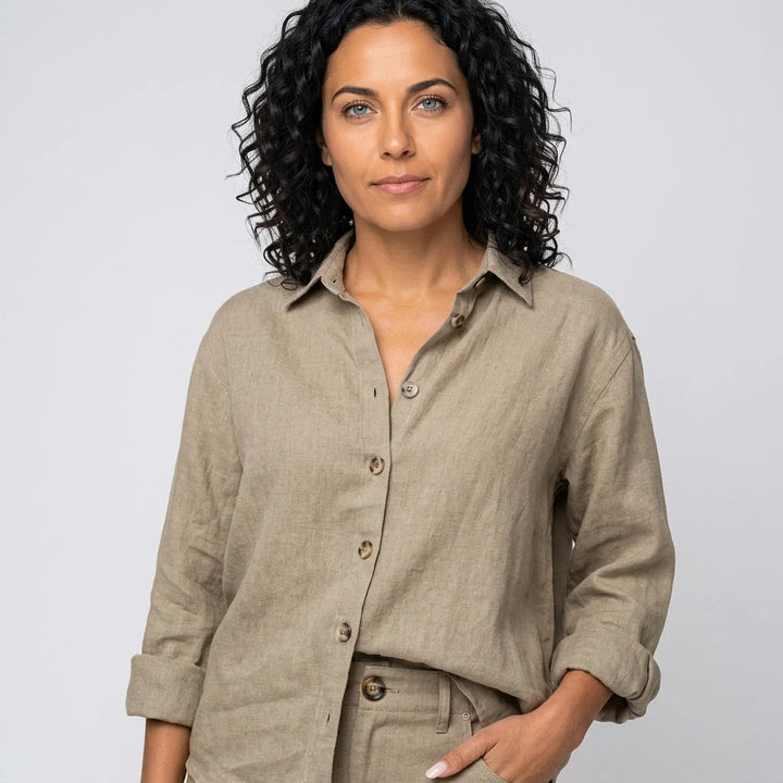 Full-length view of black relaxed linen shirt styled with casual trousers for everyday wear