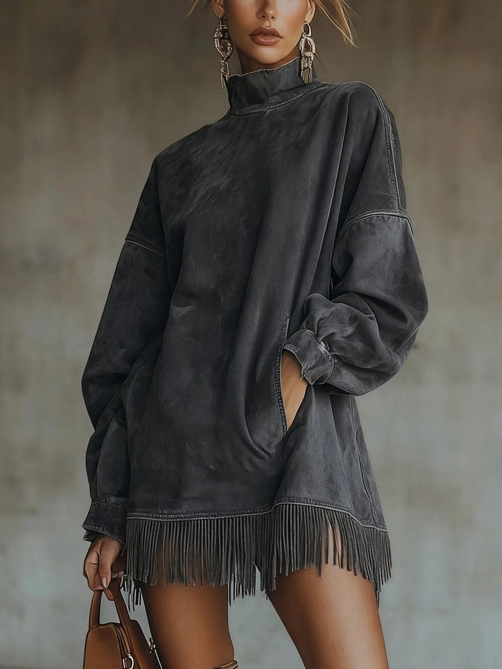 Side view of oversized sweatshirt with dropped shoulders and wide sleeves with fringe trim