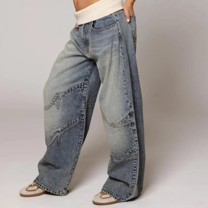 Side view of wide leg baggy jeans showing relaxed silhouette and authentic vintage fading details throughout
