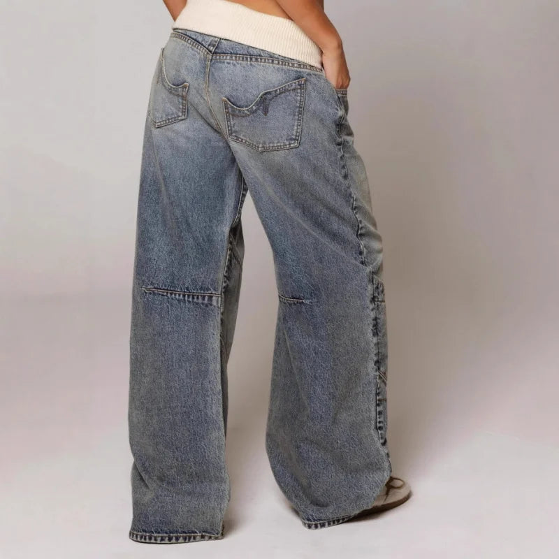 Back view of women's wide leg jeans displaying 5-pocket styling and vintage wash with natural whiskering