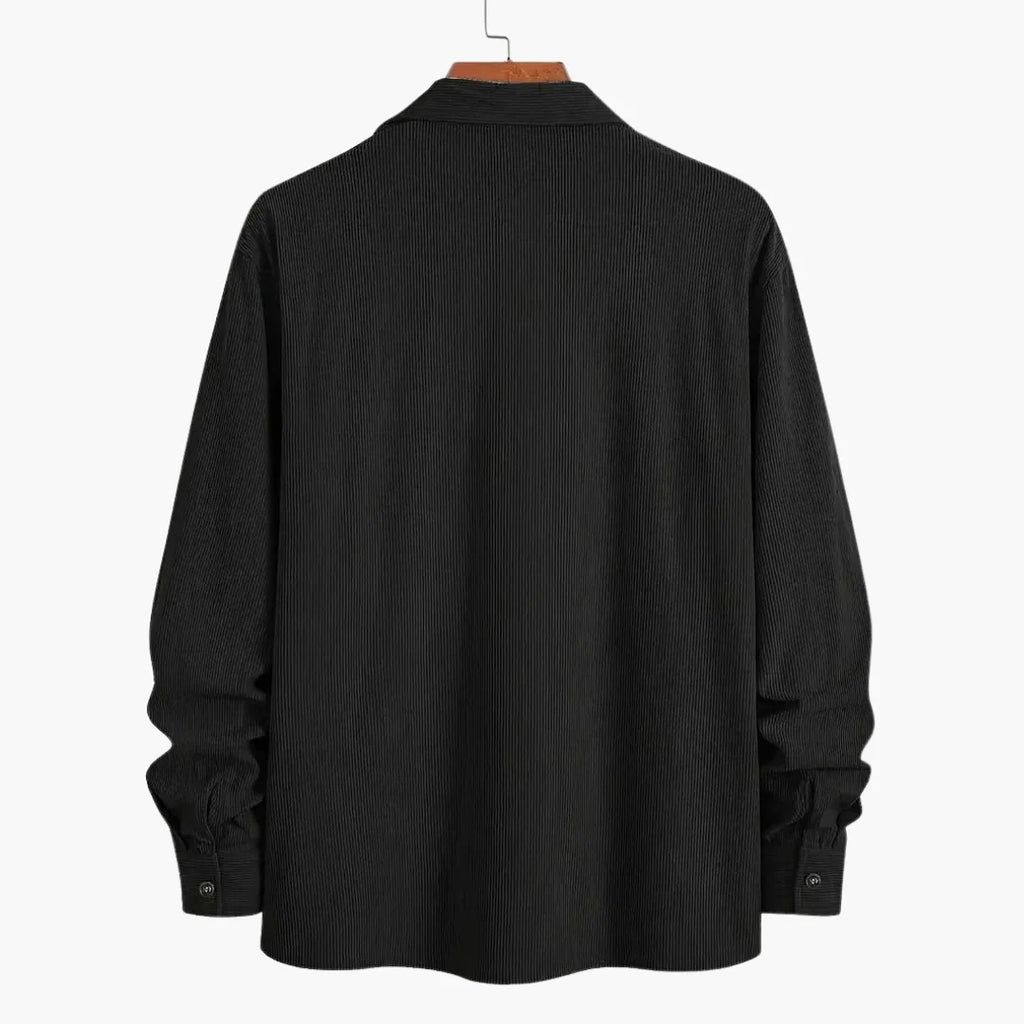 Men's corduroy shirt jacket showing textured fabric and dual chest pocket design