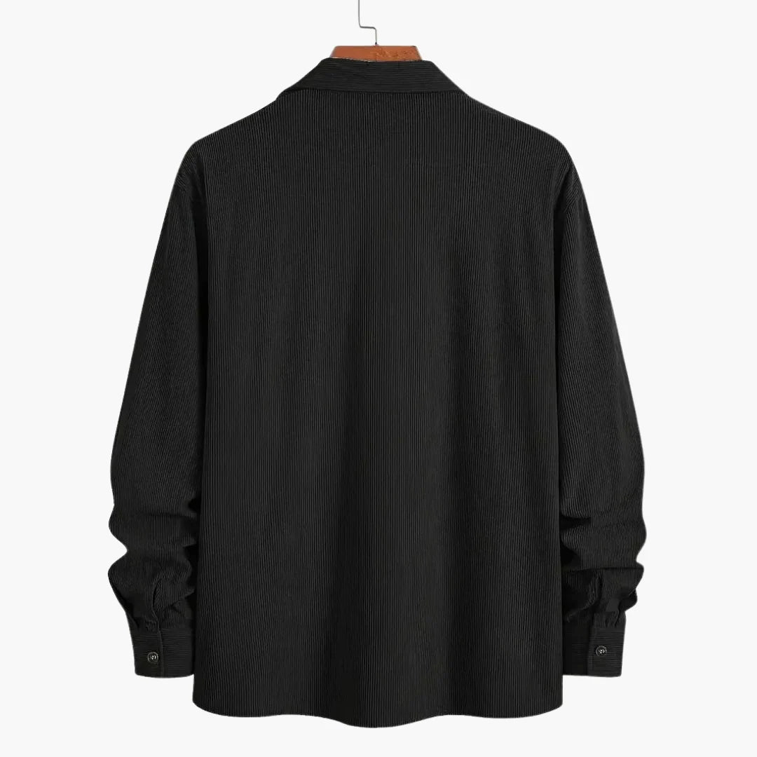 Men's corduroy shirt jacket showing textured fabric and dual chest pocket design