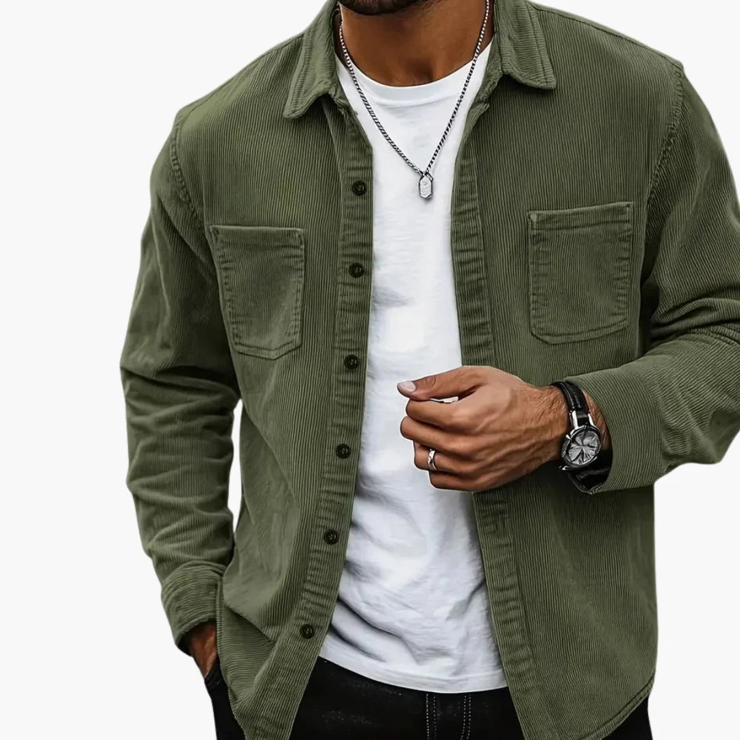 Close-up of men's blue corduroy shirt jacket showing textured ribbed fabric and button detail