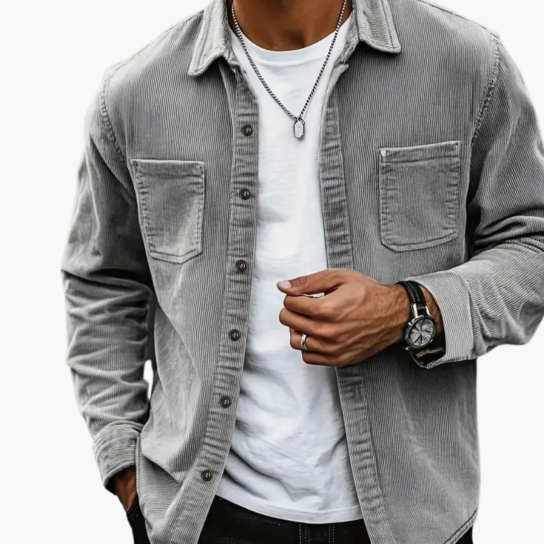 Men's corduroy shirt jacket styled over white tee with relaxed fit and classic collar