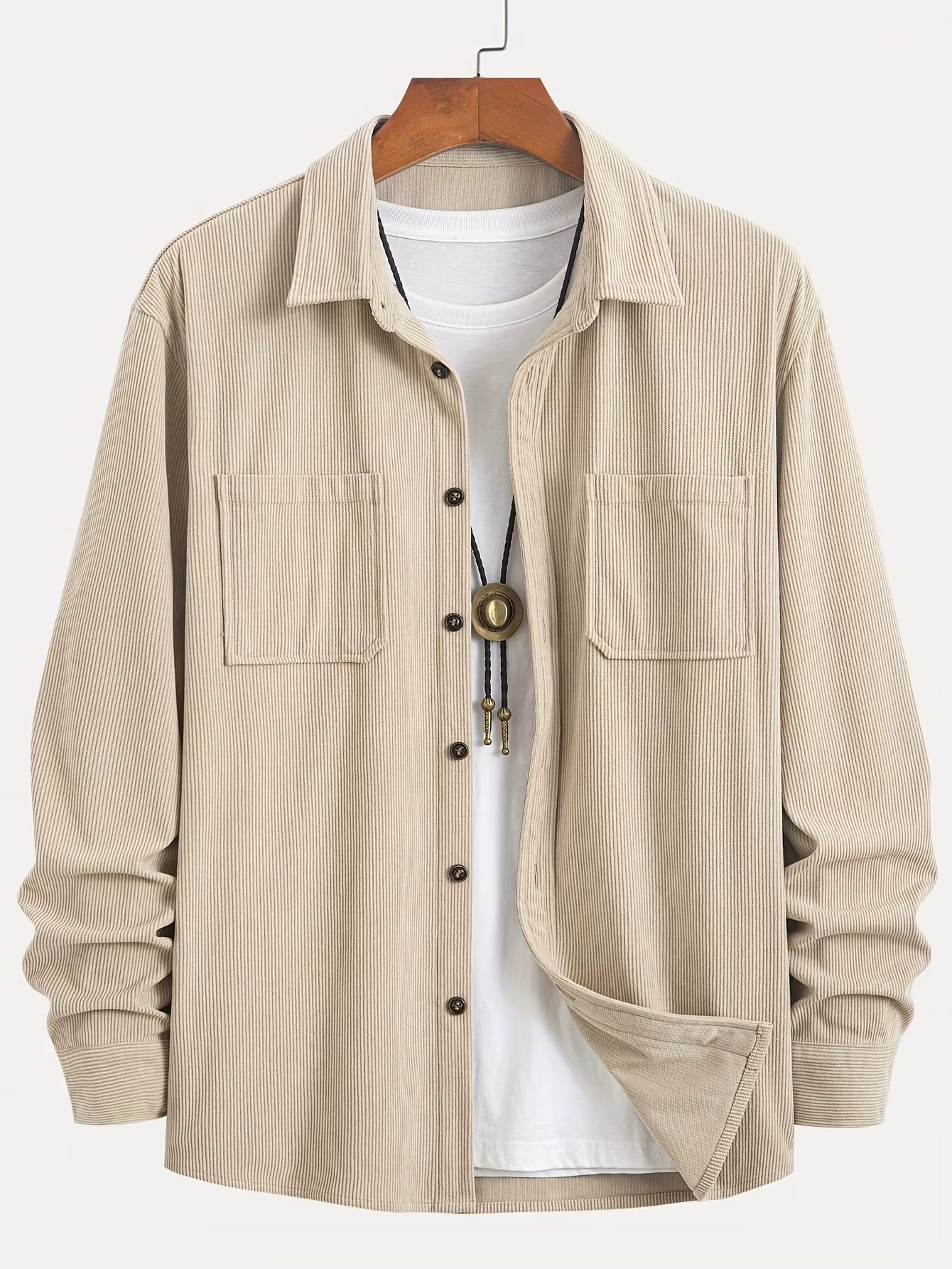 Men's corduroy shirt jacket showing chest pocket detail and button-through front closure