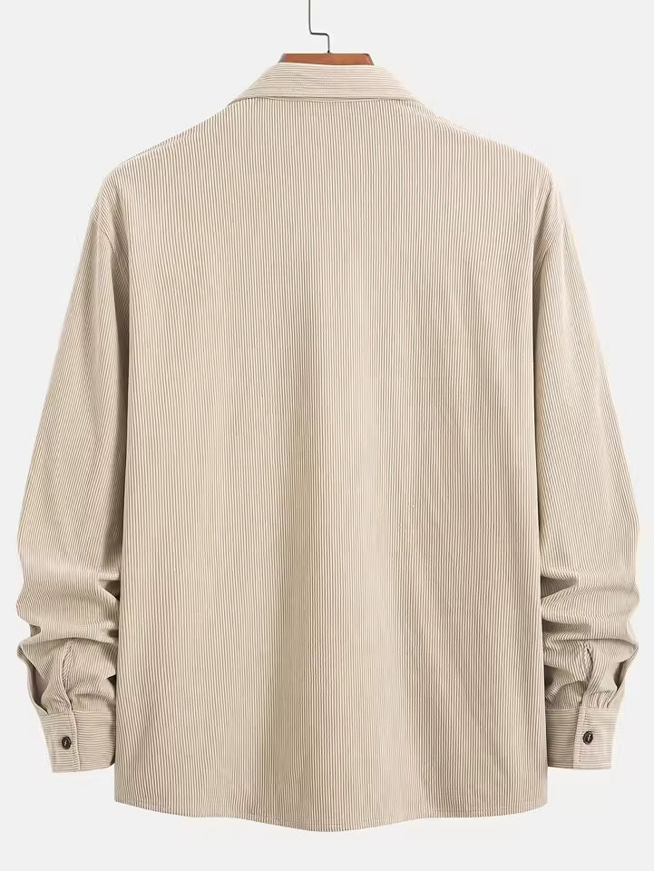 Men's blue corduroy shirt jacket layered casually over tee for weekend wear