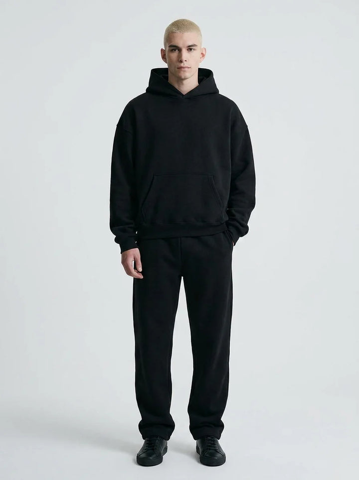 Front view of men's oversized tracksuit showing relaxed hoodie and coordinating trousers
