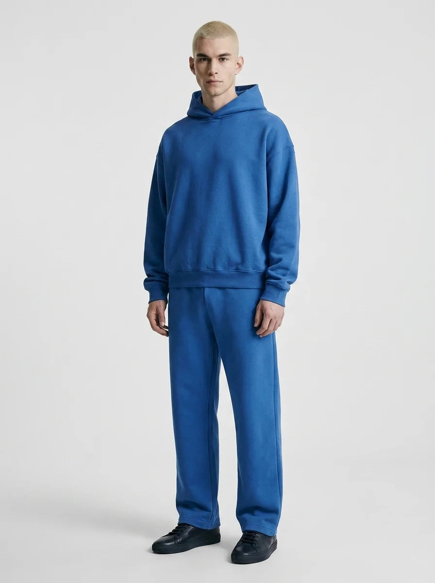Close-up of men's tracksuit hoodie with drawstring hood and ribbed cuffs