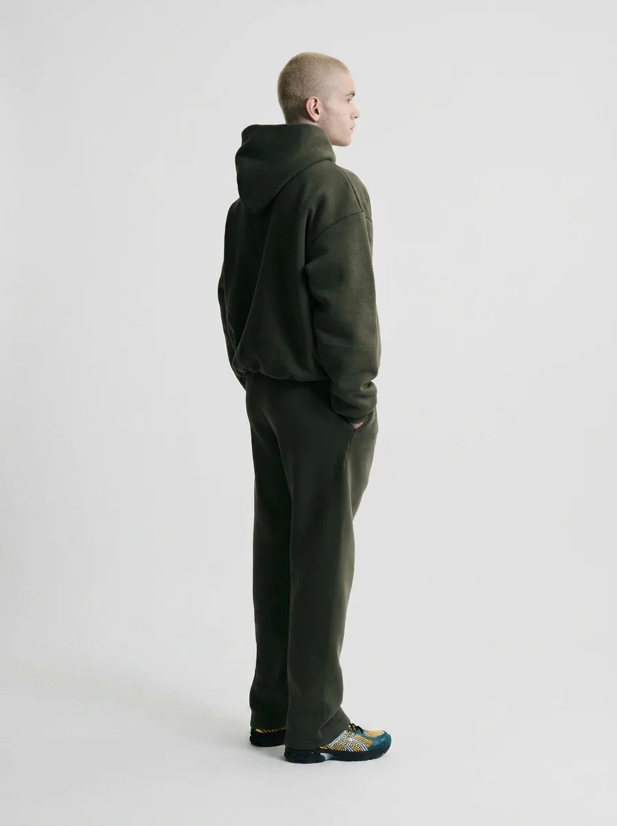 Detail shot of men's tracksuit trousers with elasticated waistband and soft fleece fabric