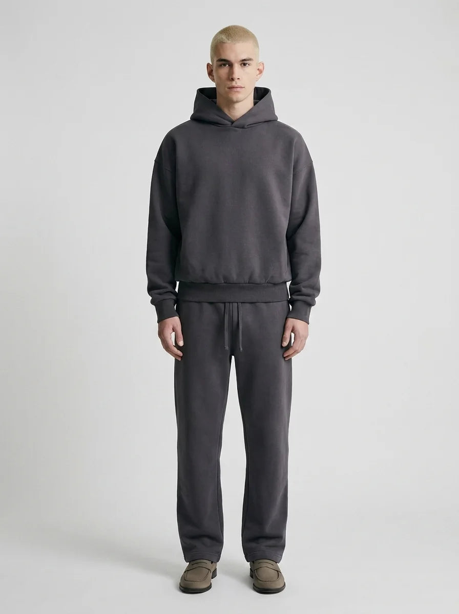 Men's tracksuit set styled with trainers for casual everyday wear