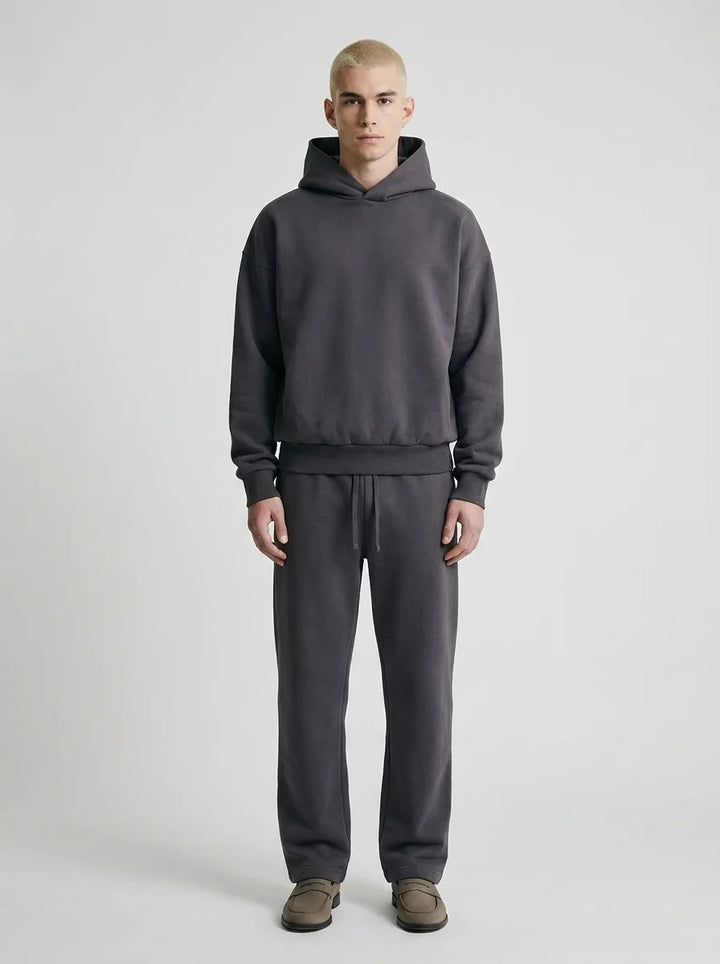 Men's tracksuit set styled with trainers for casual everyday wear