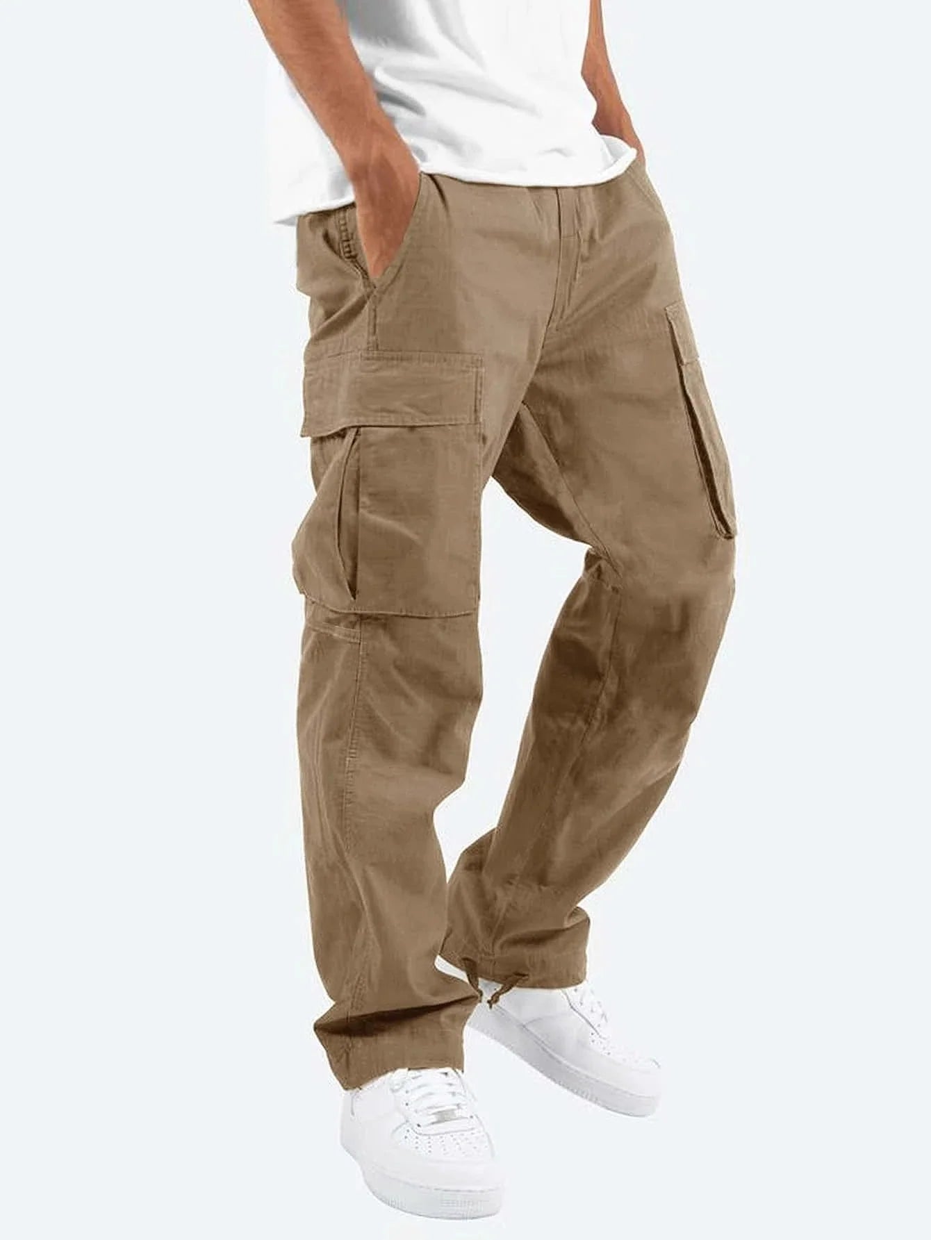 Men's relaxed cargo trousers styled with white trainers for casual weekend wear